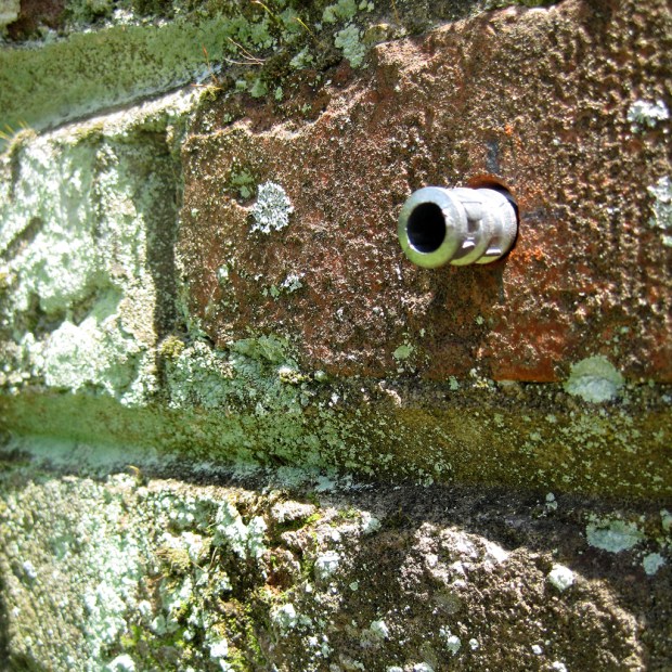 lead anchor brick wall