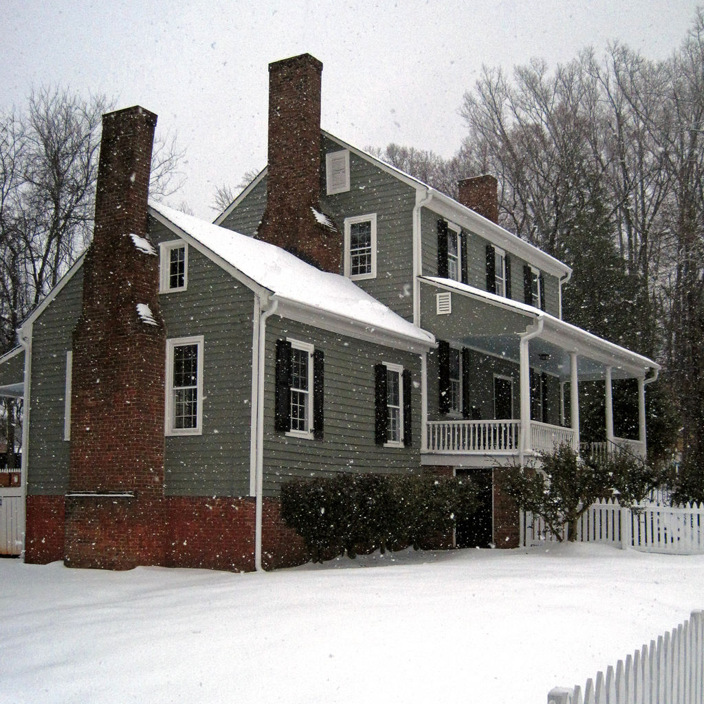 colonial house in snow